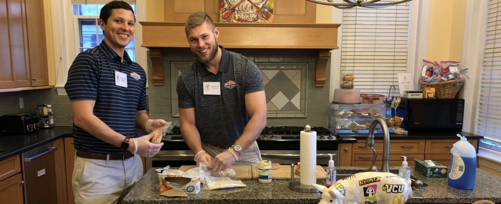 two volunteers making lunches for families and guests of rmhc richmond