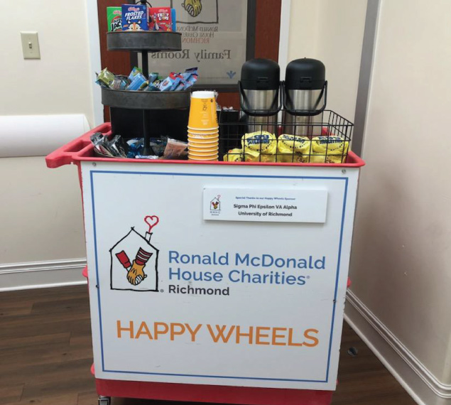 happy wheels cart filled with snacks and drinks for mcdonald's family room guests